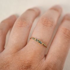 All at once delicate and intricately structured. Ancient at heart with lush blue-green parti sapphires embedded in warm 14k gold. Our Sapphire Cyndra ring is a future heirloom. She couples flawlessly with any other bands or can shine all on her own. Band tapers from 1.3mm to 1.5mm at the thickest point. 14k yellow, rose, white, or champagne goldBlue-green parti sapphires throughout the band from 0.9mm at the ends to 2.5mm at the centre. Please note that the blues and greens vary in each stone; s Laurie Fleming, Rainbow Sapphires, Blue Green Sapphires, Diamond Stacking Rings, Sapphire Color, Green Sapphire, 14k White Gold Ring, Engagement Ring Wedding Band, Yellow Sapphire