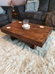 a living room with two couches and a coffee table in front of the couch