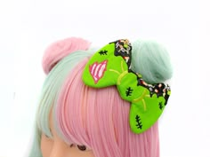 "This cute super cute zombie themed decoden frosted hair bow will liven up any zombie lovers day! If you love wearing the cutest hair accessories, then my these hair clip are for you. ♥ Super Cute Themed Poly Clay Sprinkles ♥ Measures approx. 4.5\" across x 3\" high ♥ Designed by & exclusive to Kawaii Hair Candy ♥ Made in the USA ♥ Intended for use by adults only We hope you add this to every hair style you ROCK!" Dino Costume, Gamer Fashion, Zombie Lover, Frosted Hair, Kawaii Hair, Cute Zombie, Clay Sprinkles, Candy Hair, Pretty Halloween