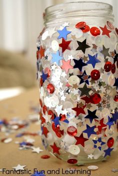 a jar filled with red, white and blue stars