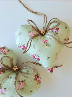 two heart shaped cushions tied with twine