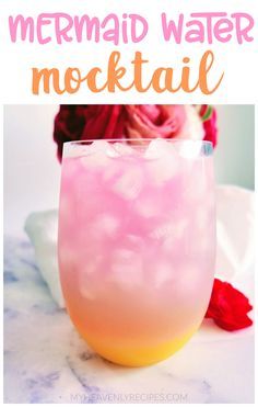 a pink and yellow drink in a glass with the words mermaid water cocktail on it