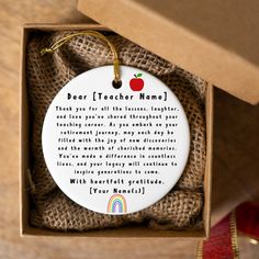 a teacher appreciation ornament in a gift box