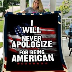 a woman holding up a blanket that says i will never apoloize for being american