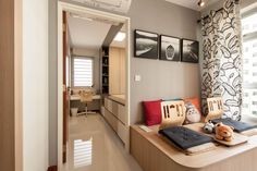 a living room filled with furniture next to a window