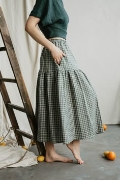 100% linen skirt for women. Comfortable, with an elastic band waist, yet classy looking linen skirt. Perfect for any occasion, from going to the office, to a date or a day out in the city or the beach. Pair it with a lovely top and wear to a special occasion, also! Available in green checks (gingham), sunshine yellow and forest green.   <> Ugnė is 180cm/5'9" and wearing size S in Green Checks Elžbieta is 165cm/ 5'4" and wearing size S in Sunshine Yellow Gabija is 177cm/ 5'8" and wearing size M i Long Linen Skirt, Finnish Fashion, Green Gingham, Knit Bottom, Skirt For Women, Sunshine Yellow, Elegant Skirt, Half Zip Sweaters, Linen Skirt