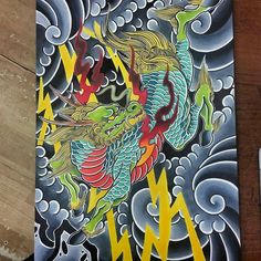 a drawing of a dragon with lightning coming out of it's mouth on a piece of wood