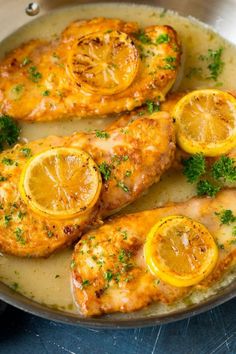 chicken with lemons and parsley in a pan