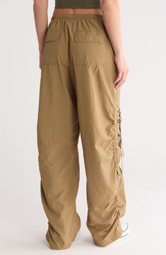 Dive into the high-volume trend in these nylon parachute pants animated with ruching and deep pockets. Leg patch pockets
 100% nylon Machine wash, tumble dry Imported Tan Snowboard Pants, Classic Slippers, Kids Rain Boots, Concert Looks, Flip Flop Slippers, Ugg Classic, Designer Crossbody Bags, Sweaters And Leggings, Ted Baker London