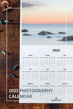 a photo calendar is sitting on top of a wooden table