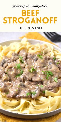 beef stroganooffe with gravy on top in a white plate