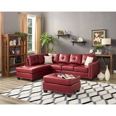 a living room with a red couch and ottoman