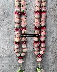 flowers arranged in the shape of letters on a wall