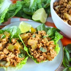 three lettuce wraps filled with meat and vegetables