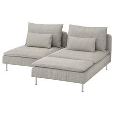 a gray couch with pillows on top of it