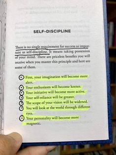 someone is holding up a book in their hand with the words self - discipline written on it