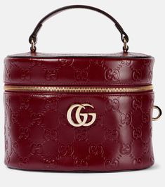 GG embossed leather vanity bag in burgundy - Gucci | Mytheresa Gucci Travel Bag, Gucci Makeup, Gucci Travel, Burgundy Bag, Vanity Bag, Leather Bag Women, Leather Briefcase, Medium Bags, Blue Bags