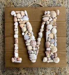 the letter m is made out of seashells