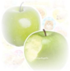 two green apples sitting next to each other