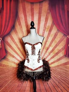 "*Please see measurements below Included in listing: Beaded Feathered corset costume top (Accessories not included) Costume available in the following sizes / Please measure your waist: Small Approximately: 32-33\" Bust, 24-25\" waist (Bra size 32A-32B) Medium Approximately: 34\" Bust, 26-27\" waist (Bra 34A-34B) Large Approximately: 36\" Bust, 28-29\" waist (Bra 34C-36C) XL Approximately: 36\" Bust, 30-32\" waist (36C/D) Waist measurement is most important *Not sure what size you need, let me k Costume Party Corset With Attached Cancan, Fitted White Corset For Costume, Strapless Corset Dress With Boned Bodice For Costume, Fitted Corset For Dance At Halloween, Fitted Fantasy Corset Dress For Fancy Dress Events, Fitted Fantasy Corset Dress For Fancy Dress, Fitted Corset For Dance Halloween, Fitted Corset For Halloween Dance, Strapless Corset Dress For Costume With Corset Back