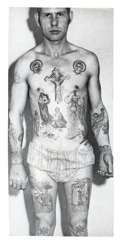 a man with many tattoos on his body