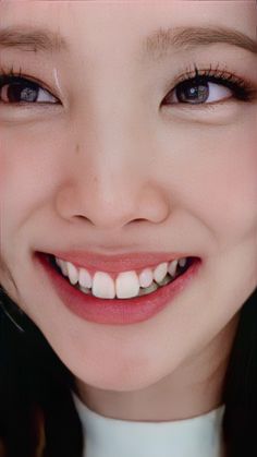 a close up of a person with a smile on their face