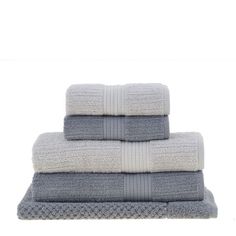 three towels stacked on top of each other in grey and white colors, with one folded