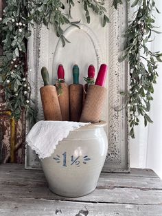 a white bowl filled with different types of kitchen utensils