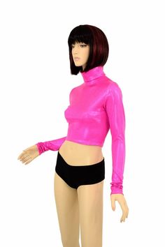 "This item is made to order, please read all the way through the listing before purchasing! Super shiny, sparkling holographic pink spandex. This crop top has a high turtle neckline and long sleeves, and a four way stretch fit. LENGTH: 8\" (from the underarm to the hemline) Womens Sizing (See below for instructions on where measurements should be taken) XXS: Bust 29\"-30\" / Waist 22\"-23\" / Hips 30\"-32\" Extra Small: Bust 31\"-32\" / Waist 24\"-25\" / Hips 33\"-35\" Small: Bust 33\"-34\" / Wa Long Sleeve High Stretch Crop Top For Party, High Stretch Long Sleeve Crop Top For Party, Fitted Turtleneck Top For Party, Pink Stretch Long Sleeve Crop Top, Pink Long Sleeve Stretch Crop Top, Pink Long Sleeve Top For Club, Fitted Long Sleeve Rave Top, Metallic Fitted Long Sleeve Tops, Pink Fitted Crop Top For Club