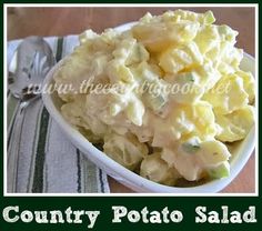 a white bowl filled with potato salad on top of a table