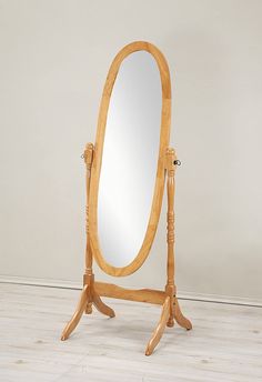 a wooden stand with a large mirror on it's legs and an oak frame