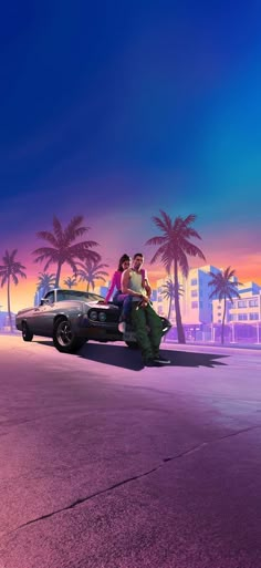 two people sitting on the hood of a car in front of palm trees at sunset