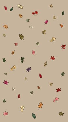 many different colored leaves are flying in the air on a light brown background with black and white