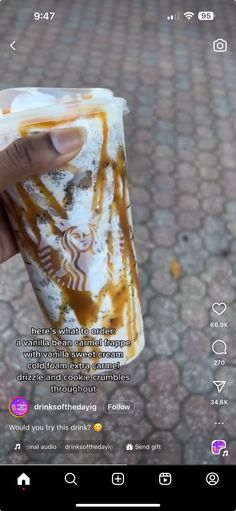 someone is holding up a cup with caramel sauce on it and the caption below