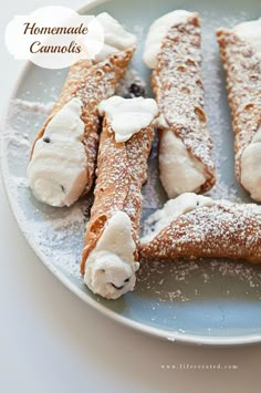 some kind of food on a plate with powdered sugar and icing around it