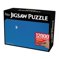 the jigsaw puzzle box is full of pieces