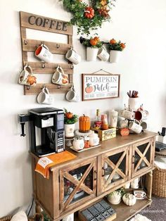 the coffee bar is decorated with pumpkins and other decorations