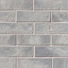 a gray brick wall is shown in this image