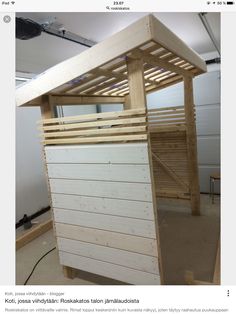 a wooden bunk bed sitting inside of a room next to a white wall and ceiling