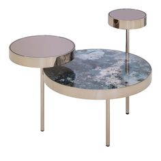 two tables with circular glass tops and metal legs, one on each side is an upside down table