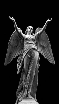 an angel statue is shown in black and white