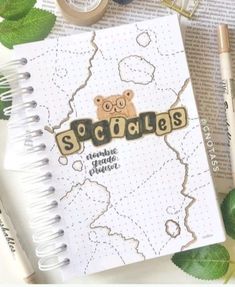 a spiral notebook with the word scrabbles on it