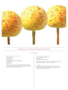 three yellow lollipops with red sprinkles on them are shown