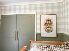 a bedroom with a bed, dresser and painting on the wall