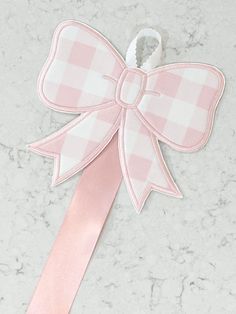 "The most precious way to store you sweet little girls bows!  Perfect for storing 12-15 bows! Fabric is a pink buffalo check with a hanging ribbon for storage measuring about 3 feet long. Bow hanger design measures 7\"X6\"." Bow Things, Chans Room, Bow Storage, Monogram Bow, Monogram Baby Girl, Pastel Bows, Bow Hanger, Embroidered Bow, Machine Applique Designs