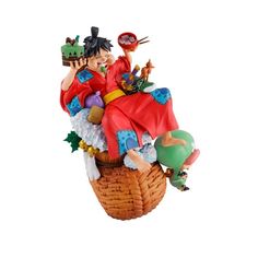 a figurine sitting on top of a basket filled with toys and other items