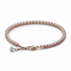 Elevate your Pandora bracelet stack with a forever piece, our Sparkling Tennis Bracelet. Featuring a row of sparkling clear cubic zirconia, this piece is sure to become a staple in your jewelry box that you reach for over and over again. Finished in 14k rose gold plating, this tennis bracelet is as elegant as it is timeless. It can be adjusted to three different lengths for ease of styling. Add depth to your stack with this sparkling piece or mix with other metal finishes for a contemporary jewe Bracelet Pandora, Hand Chain, Pandora Bracelets, Contemporary Jewellery, Pandora Bracelet, Contemporary Jewelry, Tennis Bracelet, Bracelet Stack, Pandora Charms