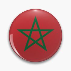 a red button with a green pentagram star on the front and back side,