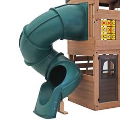 a wooden play structure with a green slide