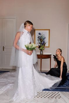 the bride is getting ready to walk down the aisle in her wedding dress and veil